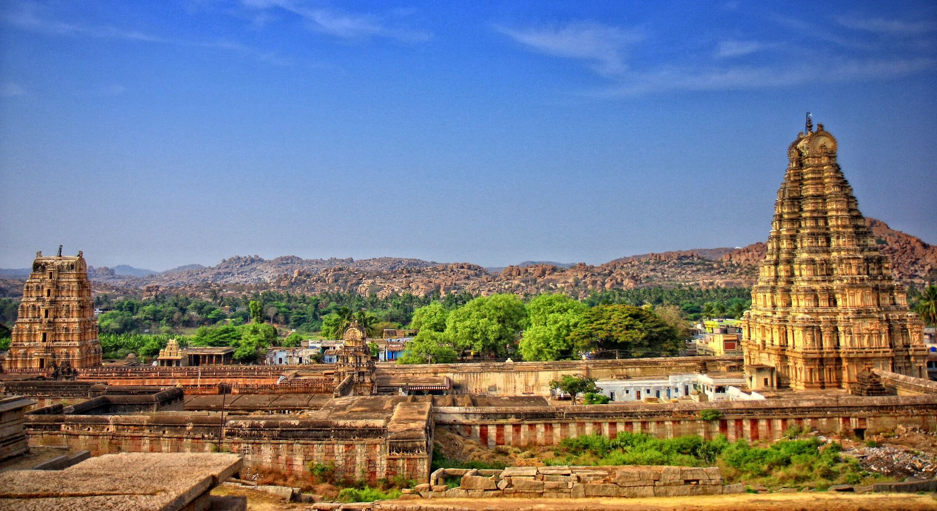 The Virupaksha or the Pampapathi temple is the main center of pilgrimage at Hampi. It is fully intact, and it incorporates some earlier structures. This temple has three towers, the eastern tower rises to a height of 160 feet and is nine tiered. It dates back to the first half of the fifteenth century and was renovated in the sixteenth century by Krishnadevaraya.